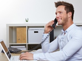 A happy man on the phone | Debt collection services Farmington Hills 
